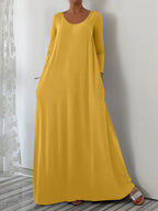 Długa sukienka z okrągłym dekoltem i długimi rękawami